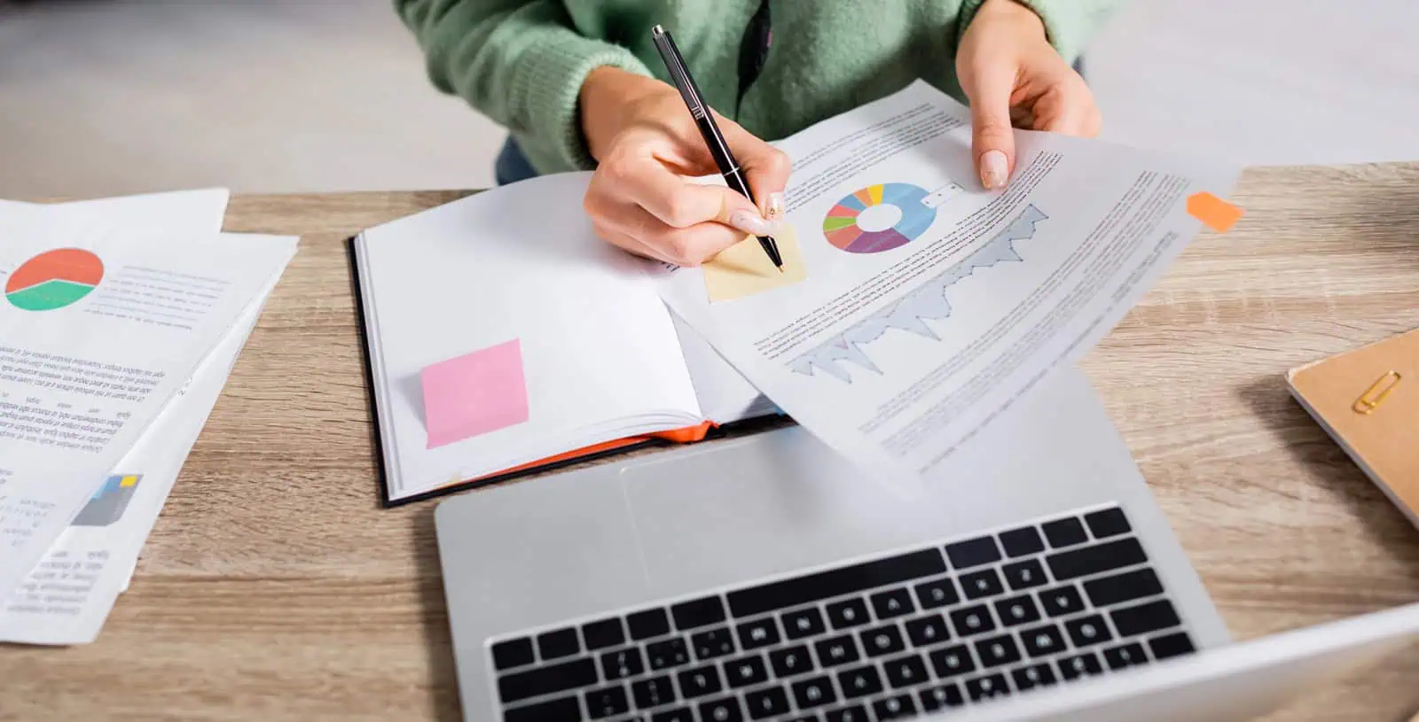 Business owner comparing marketing agency vs in-house team options at a desk